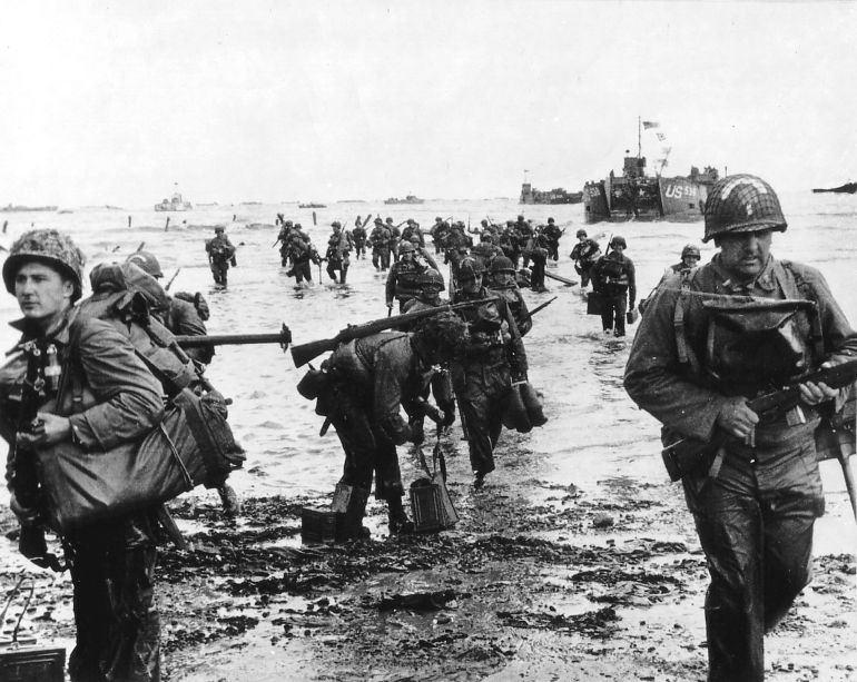 U.S. reinforcements land on Omaha beach during the Normandy D-Day landings near Vierville sur Mer, France, on June 6, 1944 in this handout photo provided by the US National Archives. On June 6, 1944, allied soldiers descended on the beaches of Normandy for D-Day - an operation that turned the tide of the Second World War against the Nazis, marking the beginning of the end of the conflict. Today, as many around the world prepare to commemorate the 70th anniversary of the landings, pictures of Normandy's now-touristy beaches stand in stark contrast to images taken around the time of the invasion. But while the landscape has changed, the memory of the momentous event lives on. Reuters photographer Chris Helgren compiled a series of archive pictures taken during the 1944 invasion and then went back to the same places, to photograph them as they appear today. Picture taken June 6, 1944. REUTERS/Cpt Herman Wall/US National Archives/Handout via Reuters (FRANCE - Tags: ANNIVERSARY MILITARY CONFLICT) ATTENTION EDITORS - THIS PICTURE WAS PROVIDED BY A THIRD PARTY. REUTERS IS UNABLE TO INDEPENDENTLY VERIFY THE AUTHENTICITY, CONTENT, LOCATION OR DATE OF THIS IMAGE. THIS PICTURE IS DISTRIBUTED EXACTLY AS RECEIVED BY REUTERS, AS A SERVICE TO CLIENTS. FOR EDITORIAL USE ONLY. NOT FOR SALE FOR MARKETING OR ADVERTISING CAMPAIGNS. ATTENTION EDITORS: PICTURE 07 OF 34 FOR PACKAGE 'WWII - THE D-DAY LANDINGS, 70 YEARS ON' TO FIND ALL IMAGES SEARCH 'D-DAY HELGREN'