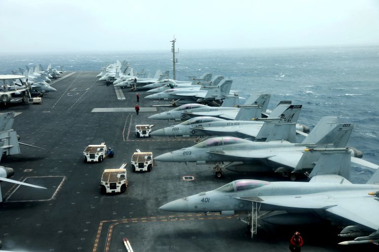 FILE PHOTO: F/A-18F aircrafts are seen on the deck of USS Abraham Lincoln in the Gulf of Oman near the Strait of Hormuz July 15, 2019. Picture taken July 15, 2019. REUTERS/Ahmed Jadallah/File Photo